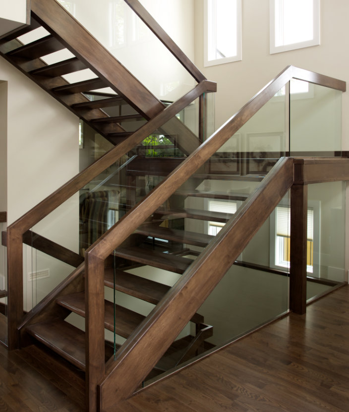 Openrise maple stair with glass panel railing.