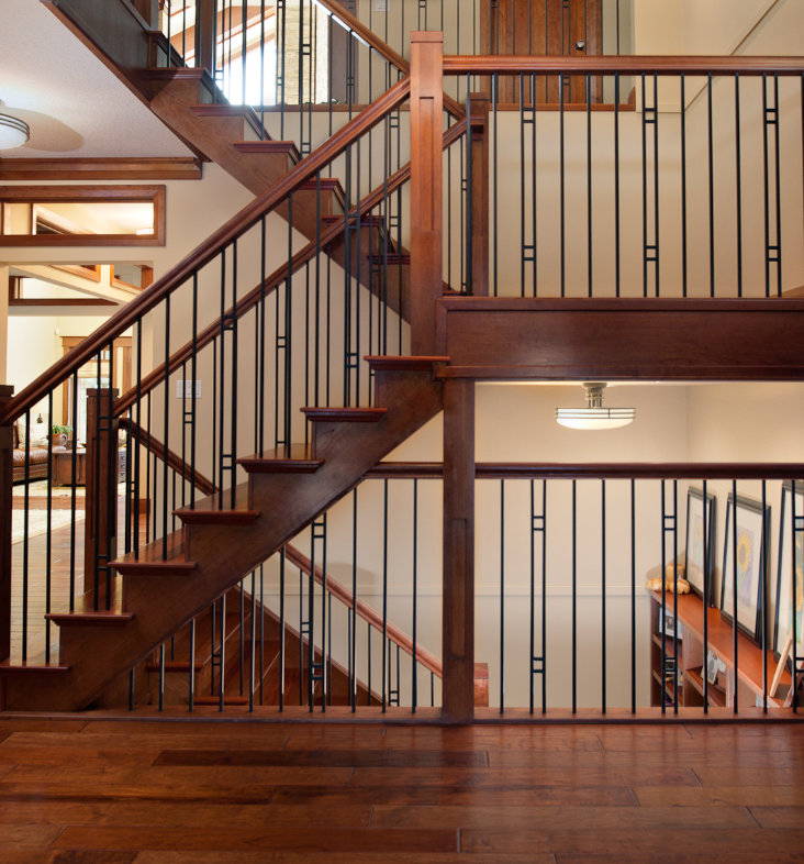 A craftsman style staircase with solid jatoba treads, cherry eastern stringers and powder coated steel spindles.