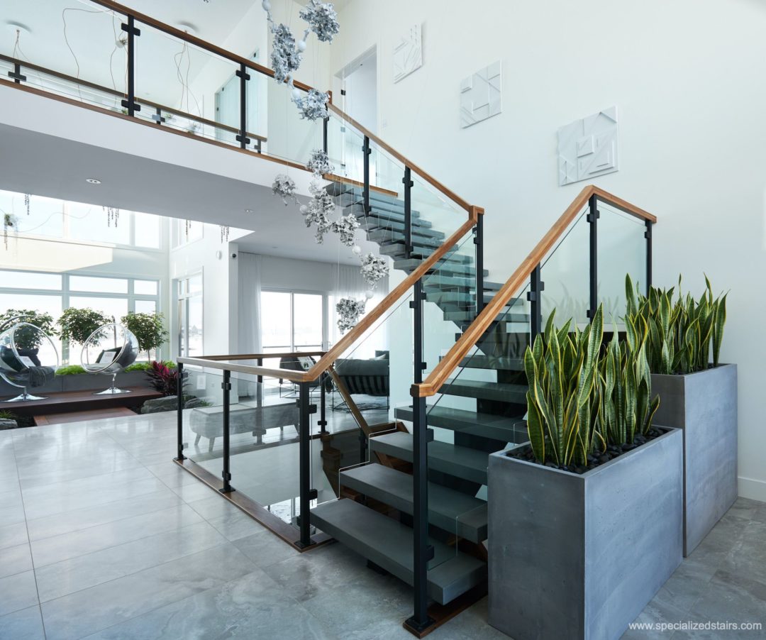 Modern Steel and Concrete Mono Stringer with Glass Railing and Walnut Handrail